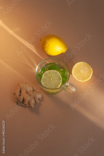 Cold season hot tea remedy vitamin c immune system concept sunny minimalist beautiful shot photo