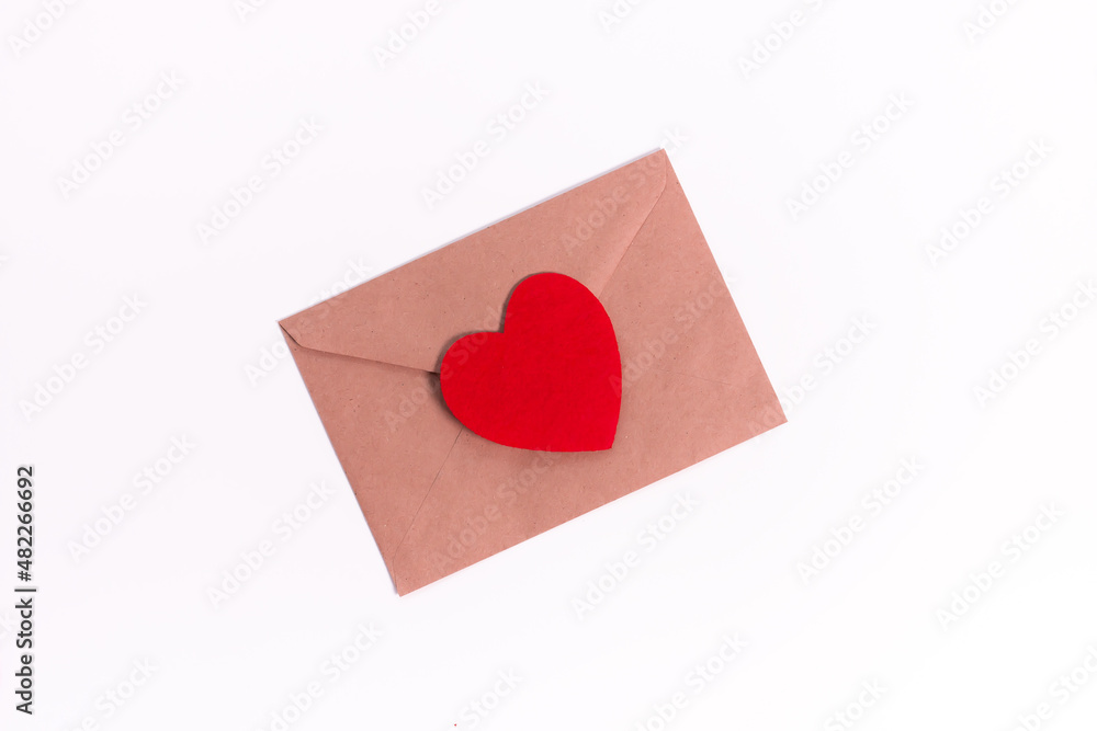 Paper envelope with blank white note mockup inside and Valentines hearts on pink background. Flat lay, top view. Romantic love letter for Valentine's day concept. Paper envelope with blank white note mockup inside and Valentines hearts on pink background. Flat lay, top view. Romantic love letter for Valentine's day concept.