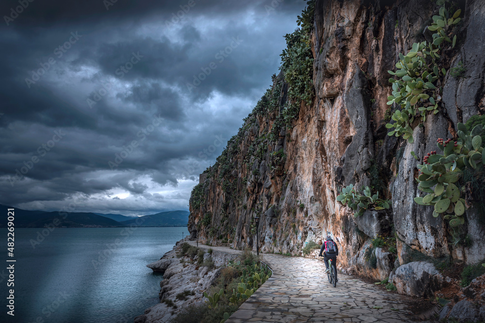 Cycling on an old path in Nafplion town. Greece, Peloponnese.

