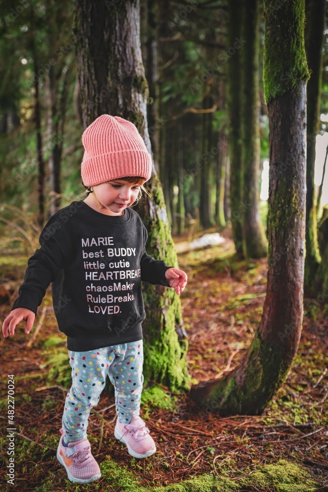 child playing in the forest child playing in the forest
