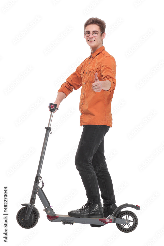 Side view of happy man rides a black kick scooter Side view of happy man rides a black kick scooter