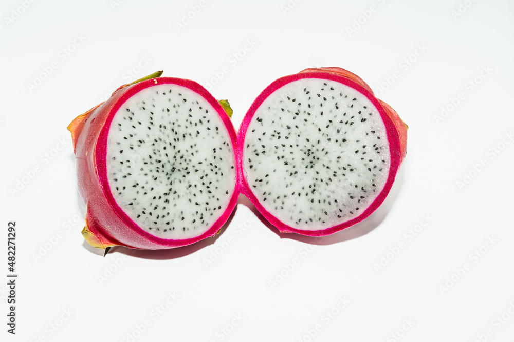 Hylocereus undatus. Pitahaya or dragon fruit cut in two halves isolated on white background. Hylocereus undatus. Pitahaya or dragon fruit cut in two halves isolated on white background.