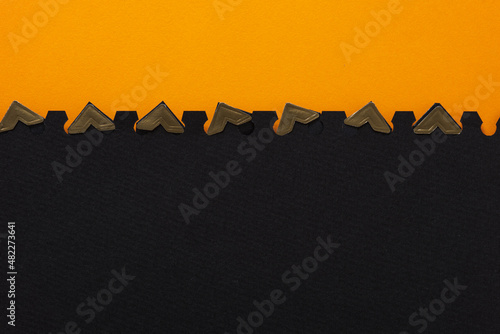 orange and black paper with photo corners