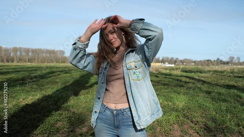 [4k] blonde natural model playing with her hair outdoors in slow motion
