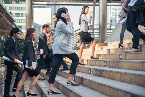 Crowd business people walking step in modern city office life. Group of businesspeople busy life urban street city lifestyle. Business People travel walk step up down. Smart People movement in town