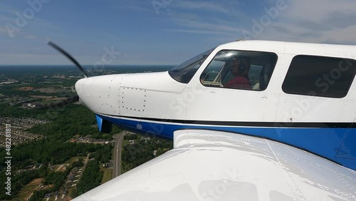 Views of a general aviation aircraft performing maneuvers on the ground and in the air photo