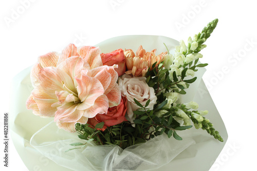 A bouquet of peach daylilies  orange and pink roses and beige chrysanthemums. Closeup