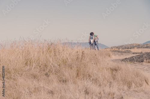 Couple kissing on the hill
