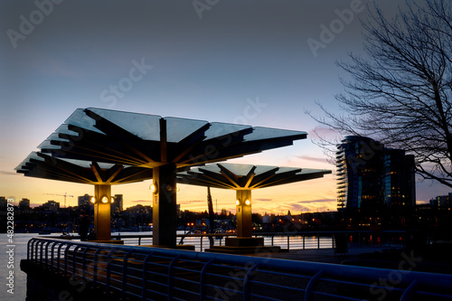 False Creek Seawall Twilight Dusk. Sheltered benches in False Creek at sunset in Vancouver. British Columbia, Canada.

 photo