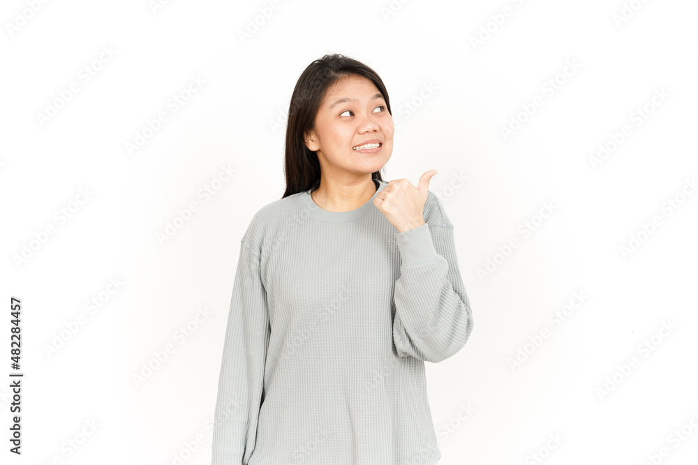 Pointing Product Using Thumb Of Beautiful Asian Woman Isolated On White Background Pointing Product Using Thumb Of Beautiful Asian Woman Isolated On White Background