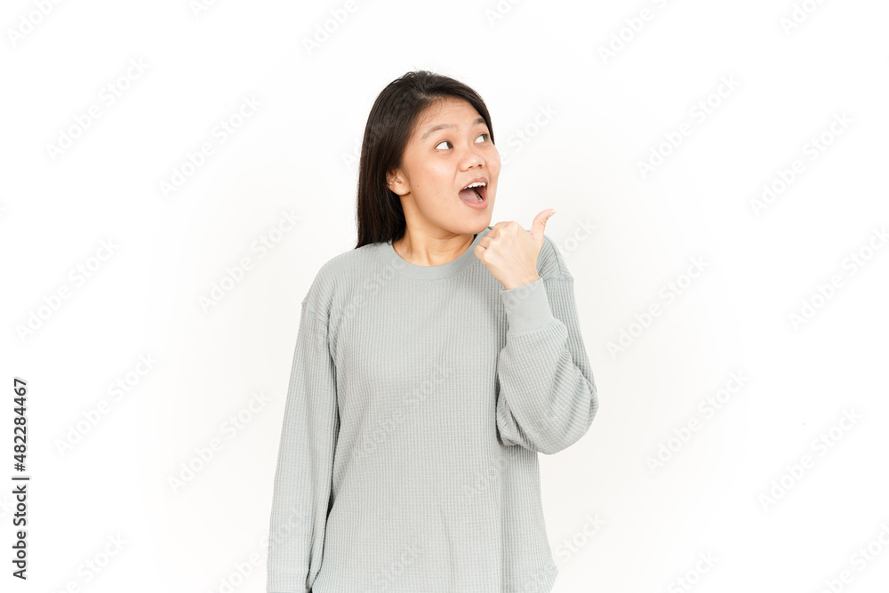 Pointing Product Using Thumb Of Beautiful Asian Woman Isolated On White Background Pointing Product Using Thumb Of Beautiful Asian Woman Isolated On White Background