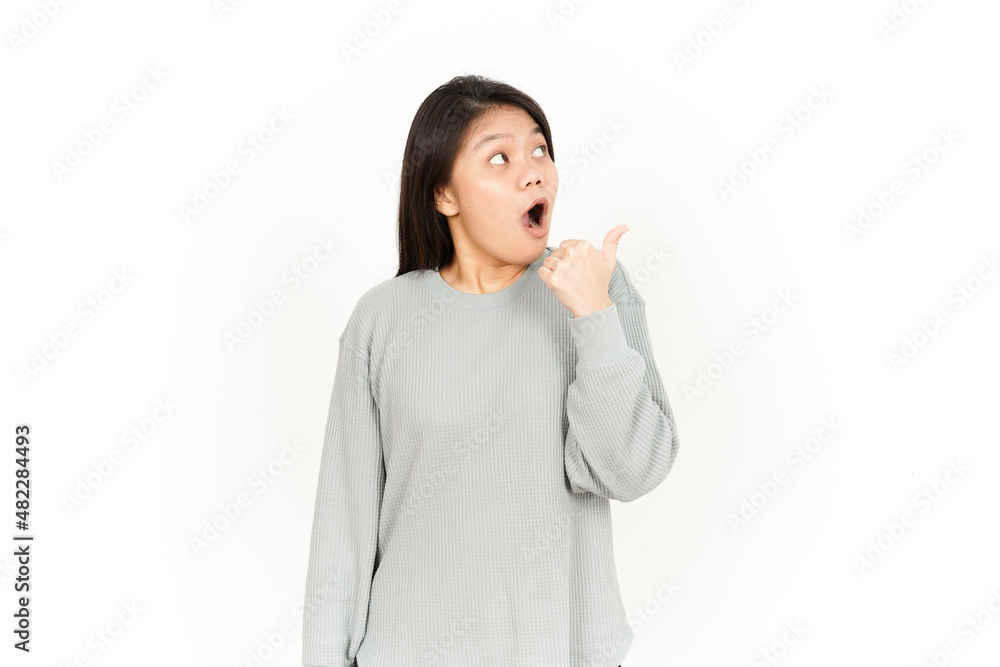 Pointing Product Using Thumb Of Beautiful Asian Woman Isolated On White Background Pointing Product Using Thumb Of Beautiful Asian Woman Isolated On White Background