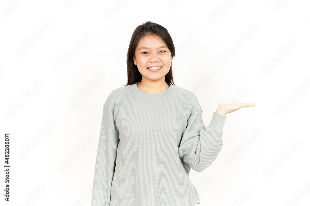 Showing Product on Open Palm Of Beautiful Asian Woman Isolated On White Background Showing Product on Open Palm Of Beautiful Asian Woman Isolated On White Background