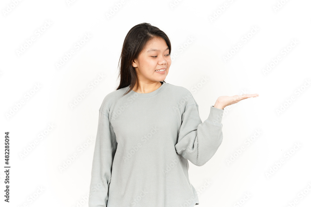 Showing Product on Open Palm Of Beautiful Asian Woman Isolated On White Background Showing Product on Open Palm Of Beautiful Asian Woman Isolated On White Background