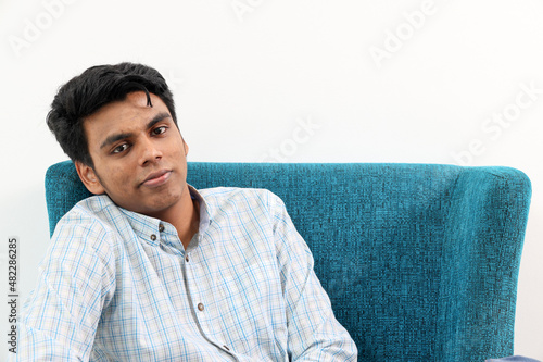 Obraz na plátne Southeast Asian young man special need medical down adhd autism syndrome sit pos