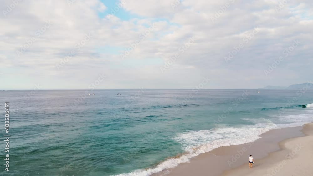 Aerial view of Barra da Tijuca Beach in the west side of Rio de Janeiro, Brazil. Sunny day with some clouds at dawn. Drone take. Aerial view of Barra da Tijuca Beach in the west side of Rio de Janeiro, Brazil. Sunny day with some clouds at dawn. Drone take.