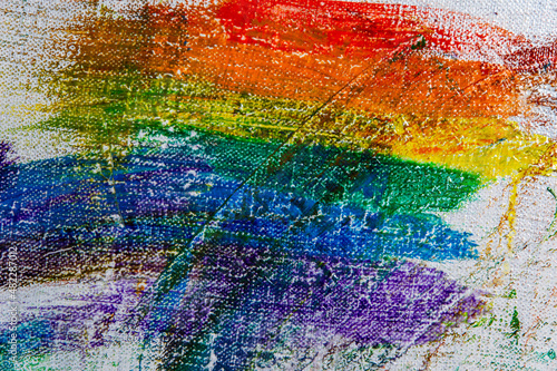 several strokes of multi-colored paint depict a frag of the LGBT community on a light surface. short focus, blur. A temporary object, not a piece of art.