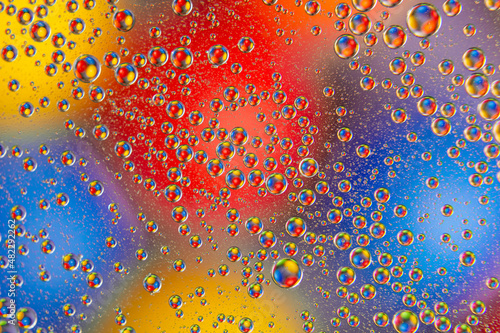 abstract colored balls of oily liquid on a blurred background