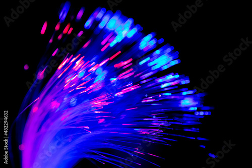Close up of blurred light fiber optics for communication technology network