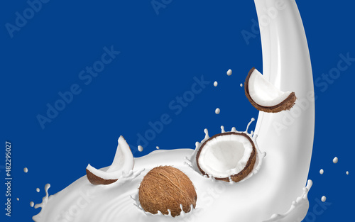 Splash de leite com a fruta coco em cima em fundo azul. (ID: 482295027)