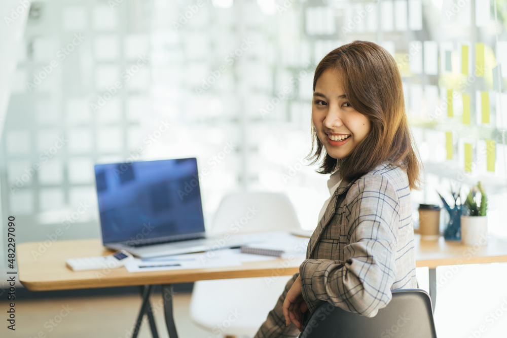 Portrait Of Asian business woman Working On Laptop In Boardroom,confident business woman. Portrait Of Asian business woman Working On Laptop In Boardroom,confident business woman.