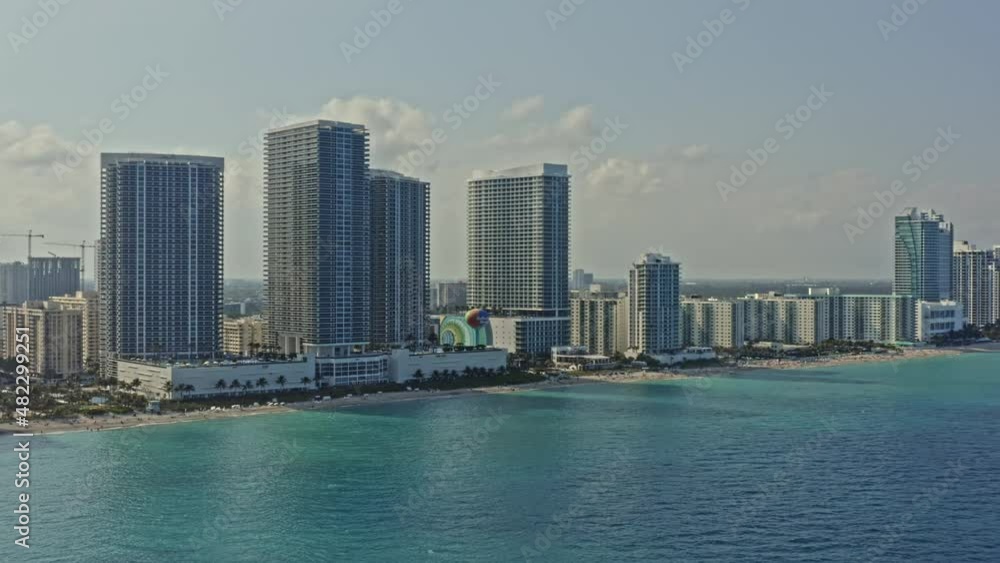 Hallandale Beach Florida Aerial v1 cinematic pan shot capturing beachfront residential condo, luxury hotel resort and high rise buildings at Hollywood city - March 2021 Hallandale Beach Florida Aerial v1 cinematic pan shot capturing beachfront residential condo, luxury hotel resort and high rise buildings at Hollywood city - March 2021