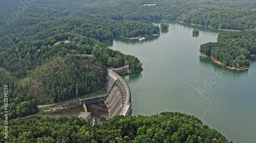 Allatoona Dam Georgia Aerial v2 breathtaking birds eye view of water reservoir, concrete gravity dam and power plant station surrounded by beautiful natural landscape - August 2021 photo