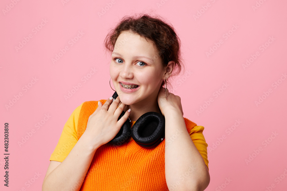 Fototapeta premium beautiful woman grimace headphones entertainment emotions music cropped view unaltered