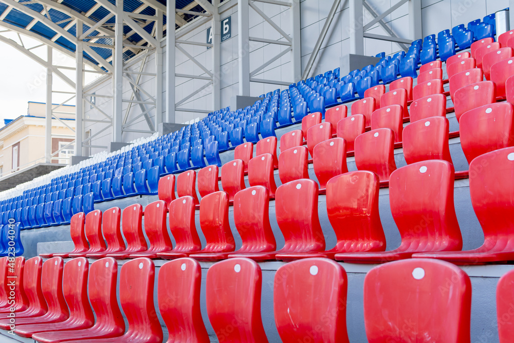 Fototapeta premium red and blue seats in the stadium.