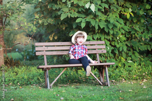 Leaf fall in the park. Children for a walk in the autumn park. Family. Fall. Happiness.