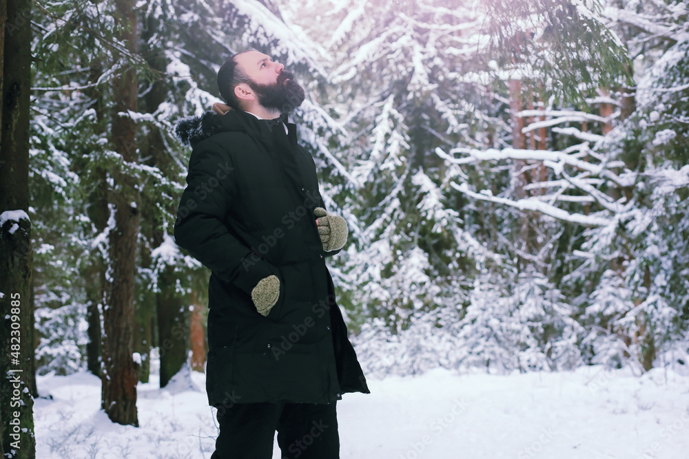 Bearded man in the winter woods. Attractive happy young man with beard walk in the park. Bearded man in the winter woods. Attractive happy young man with beard walk in the park.