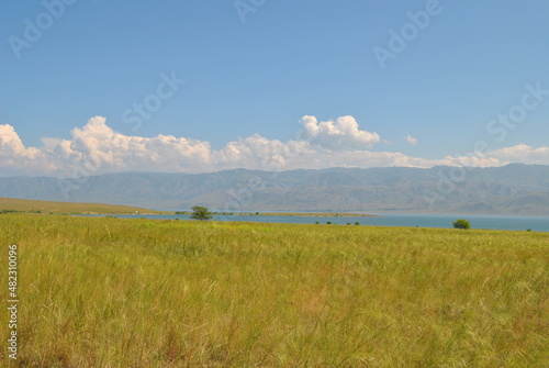 Seascape. Beautiful lake shore. Gentle clouds and blue water surface. Bukhtarma reservoir. © Anton