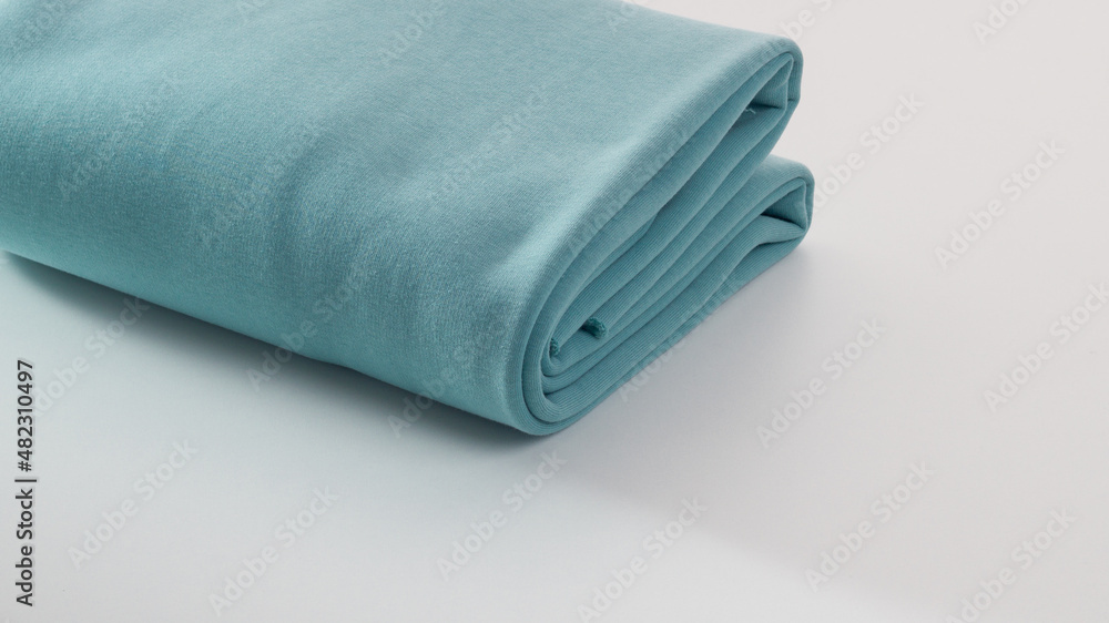 Rolls of bright colored fabric on a white background. Rolls of bright colored fabric on a white background.