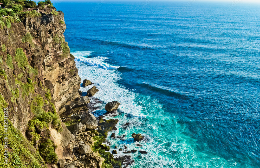 View of Uluwatu cliff and blue sea in Bali, Indonesia