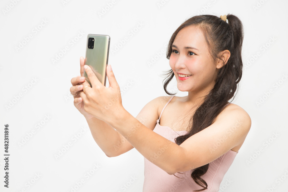 Cute Asian woman smiling and cheerful having fun selfies for social media concept Cute Asian woman smiling and cheerful having fun selfies for social media concept