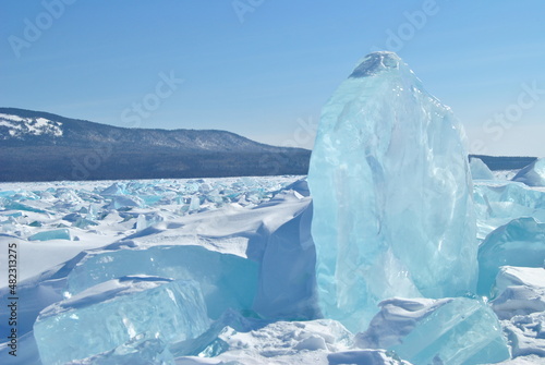 The blue ice of Lake Baikal. Baikal in winter. Transparent and clean ice of Lake Baikal.