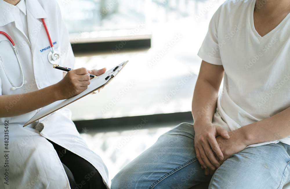 Obraz premium Urologist Doctor giving consult for prostate problems to patient. Urologic oncologists specialize in treating cancer of the urinary tract and male reproductive organs.