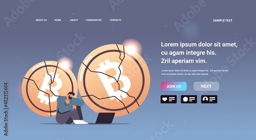 businessman sitting near crashed coin cryptocurrency crash bitcoin price collapse crypto loss investment risk crisis