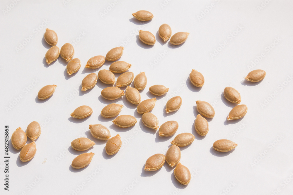 close up Sweet pumpkin seeds isolated white background. close up Sweet pumpkin seeds isolated white background.