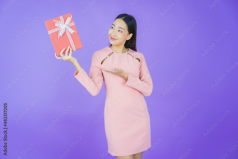 Portrait beautiful young asian woman smile with red gift box Portrait beautiful young asian woman smile with red gift box