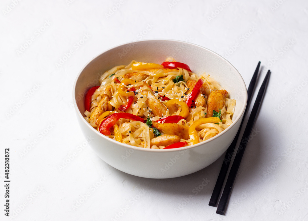 Udon noodles with chicken, pepper and sesame. Chinese food. Udon noodles with chicken, pepper and sesame. Chinese food.