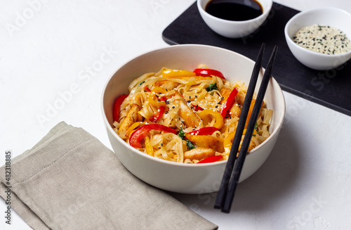 Udon noodles with chicken  pepper and sesame. Chinese food.