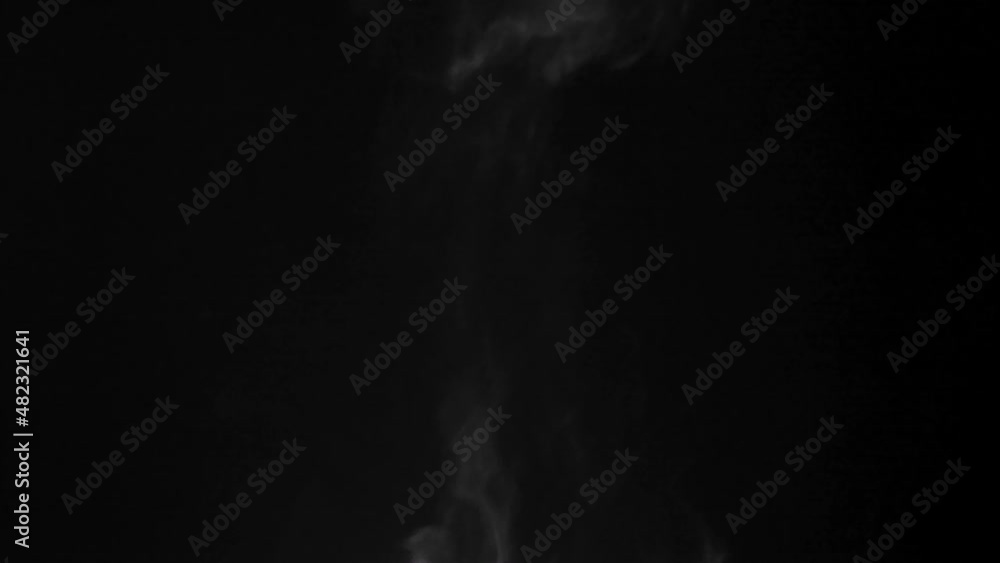 Steam over cooking pot on dark background Steam over cooking pot on dark background