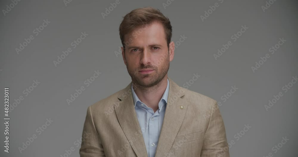 tough businessman staring at the camera and wearing a nice suit tough businessman staring at the camera and wearing a nice suit