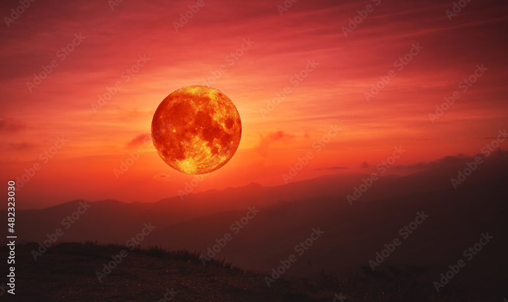 blood moon concept of a red full moon in red sky with cloud. Stock