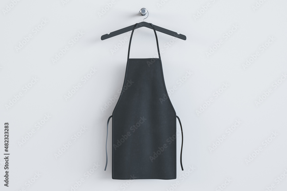 Empty black kitchen apron on hangers. Light background. Chef and cooking concept. Mock up place. 3D Rendering. - obrazy, fototapety, plakaty 