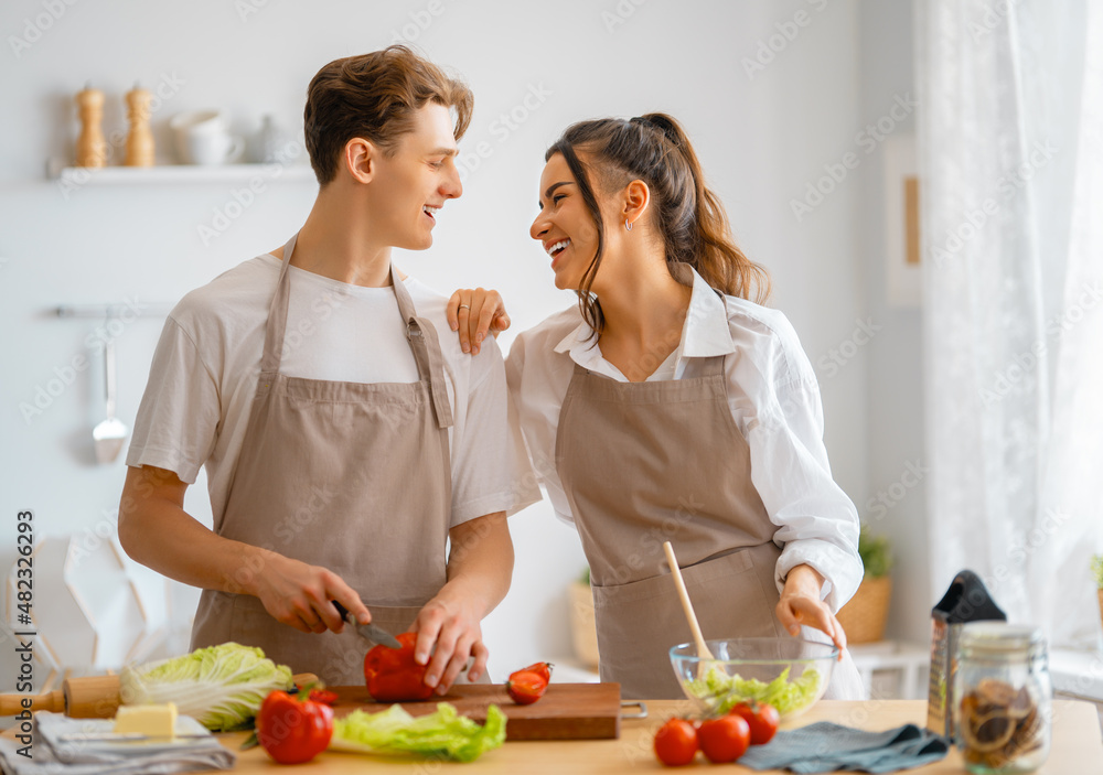 loving couple is preparing the proper meal loving couple is preparing the proper meal