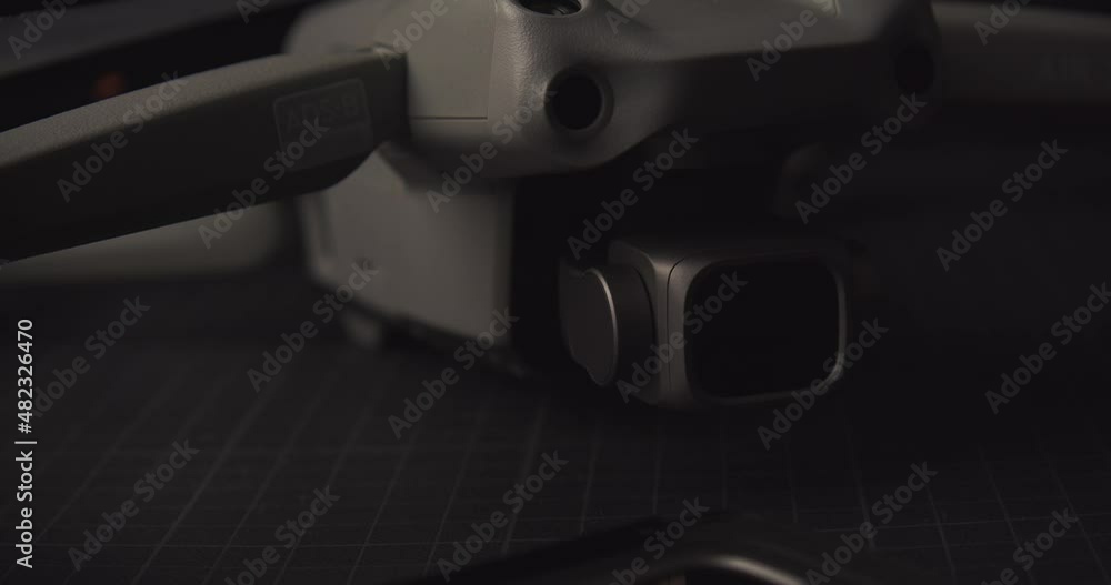 Dolly backwards from landed drone. Shallow focus, close up Dolly backwards from landed drone. Shallow focus, close up