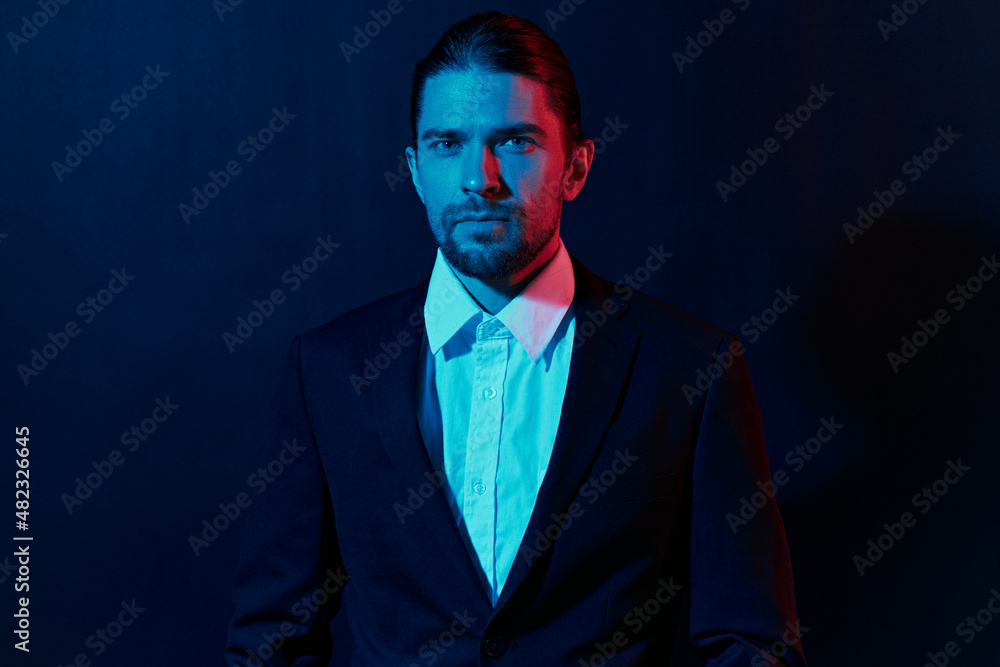 Fototapeta premium handsome man in costume posing fashion neon light