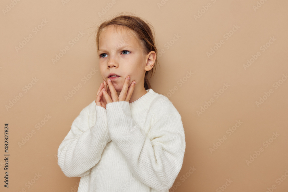 cute girl in white sweater posing hand gestures Lifestyle unaltered cute girl in white sweater posing hand gestures Lifestyle unaltered